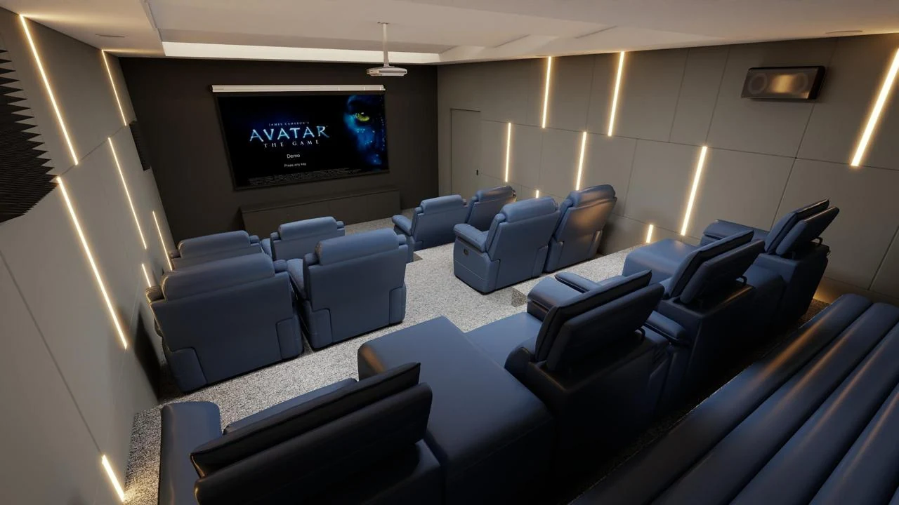 Home cinema viewed across rows of blue reclining seats toward the screen